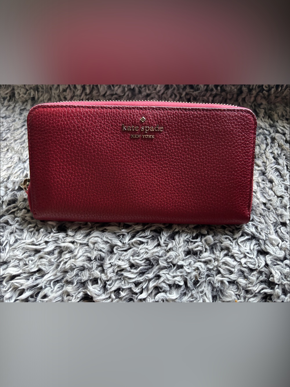 kate spade pebbled leather zip-around wallet in deep berry